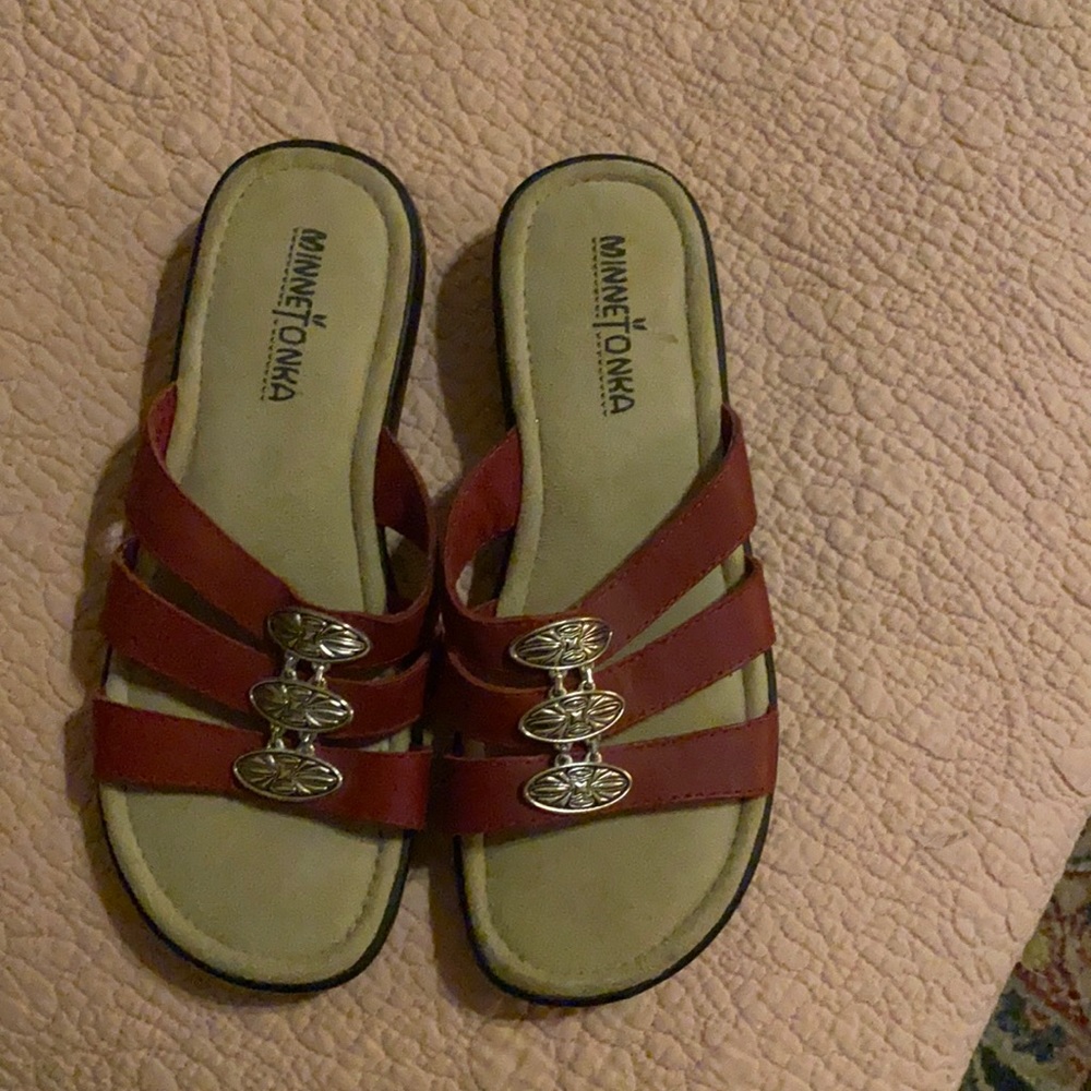 Minnetonka size 6 red sandals with beautiful silver ornate decor. New condition